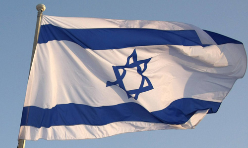 German and Israeli national flags are pictured as Israel's President Peres arrives at Berlin's Tegel airport